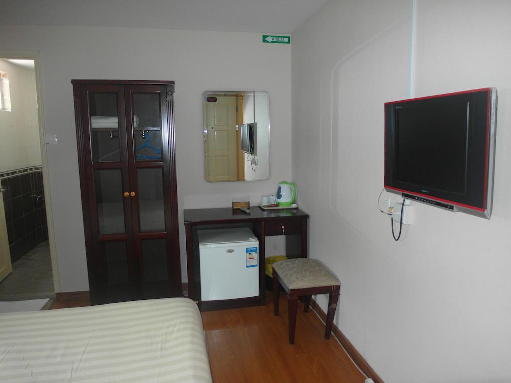 Dragon Inn Miri Habitación foto